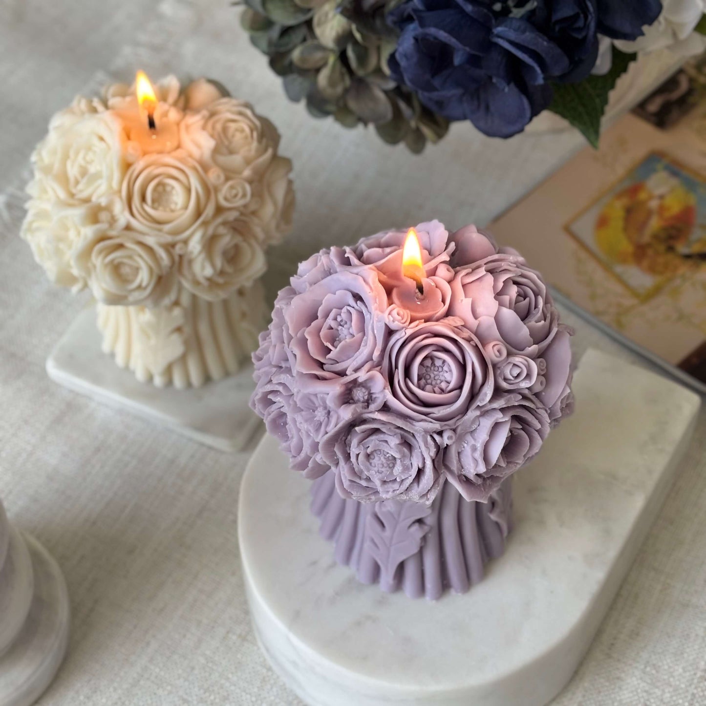 Two burning soy wax peony bouquet candles, floral sculptural home decor, handmade artisanal centerpiece for weddings and special occasions.