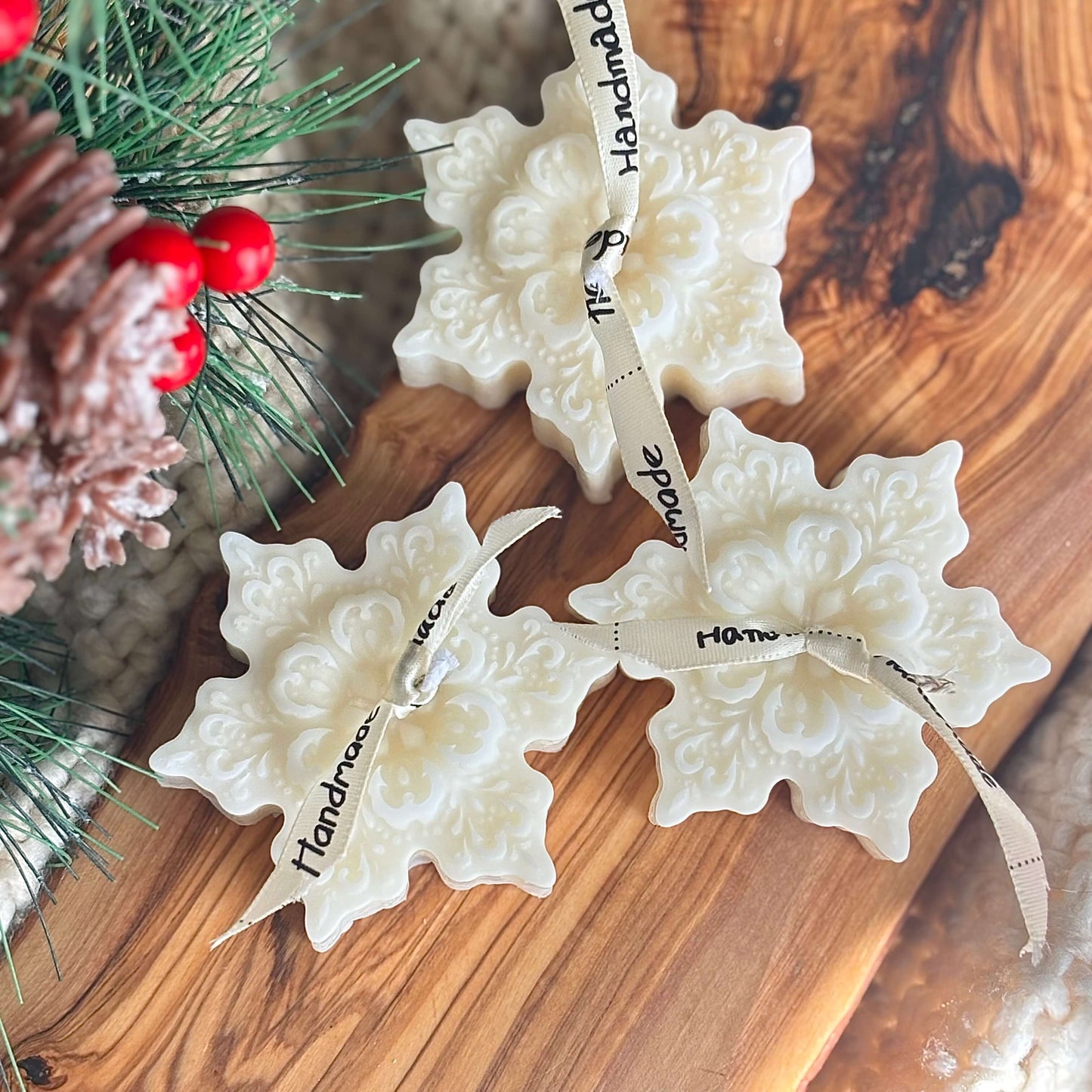 Eco-friendly handmade snowflake candles tied with handmade ribbon