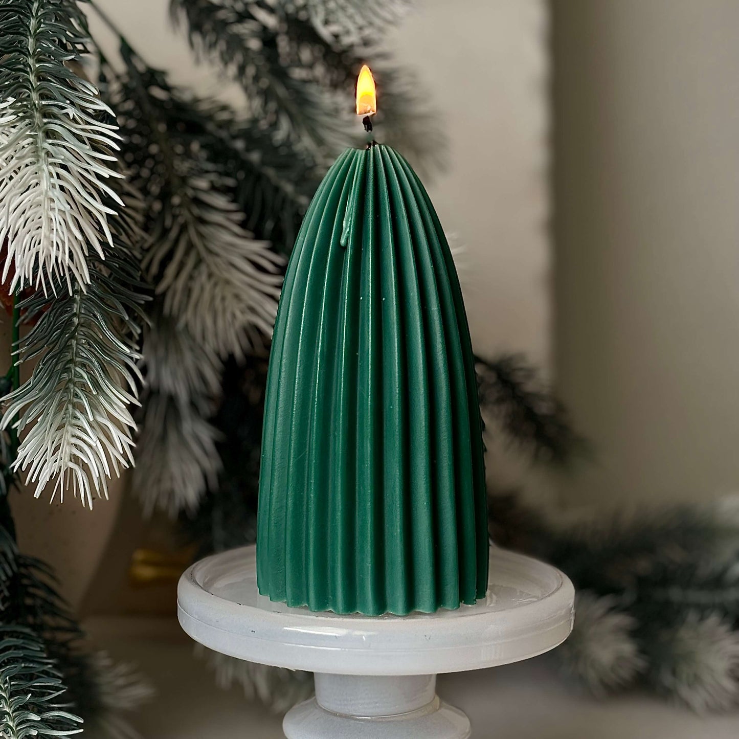 Green ribbed soy wax candle on pedestal stand, modern handmade Christmas tree decoration