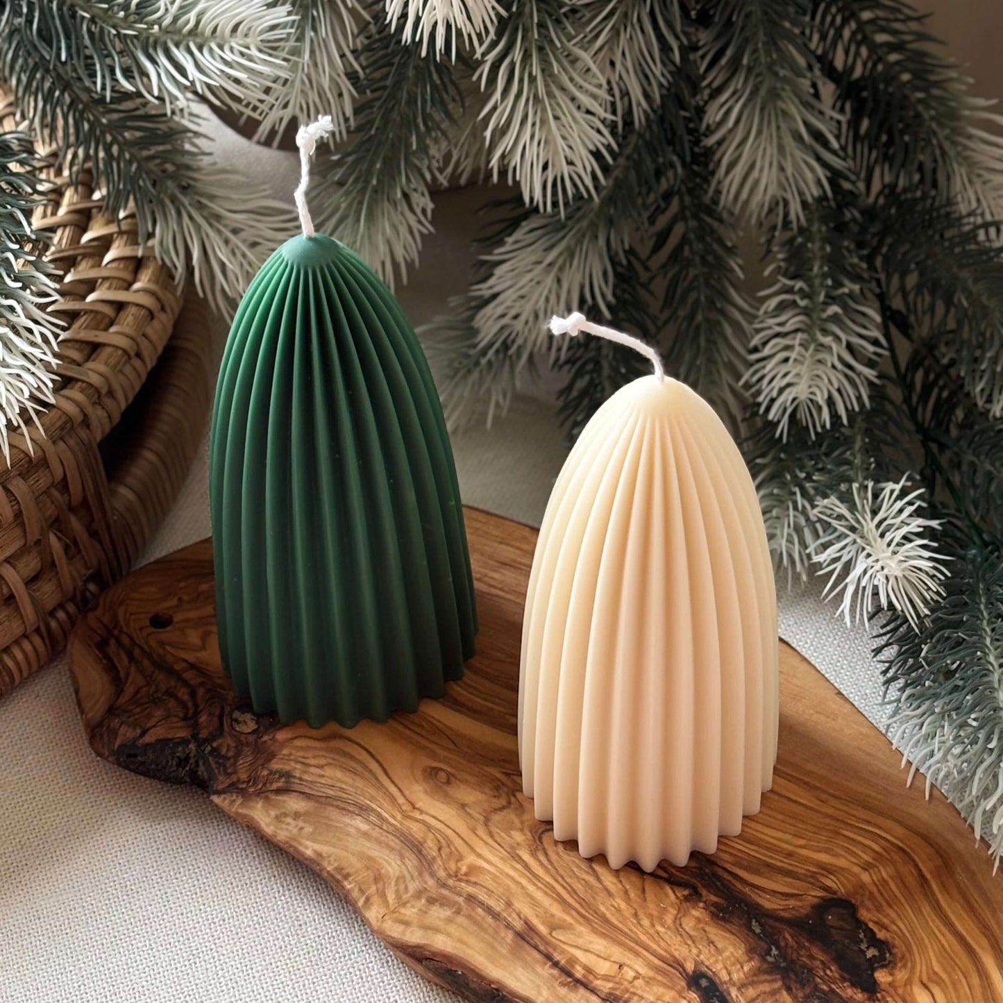 Two ribbed soy candles, green and ivory, sculptural holiday tree décor, ideal for Secret Santa gifts