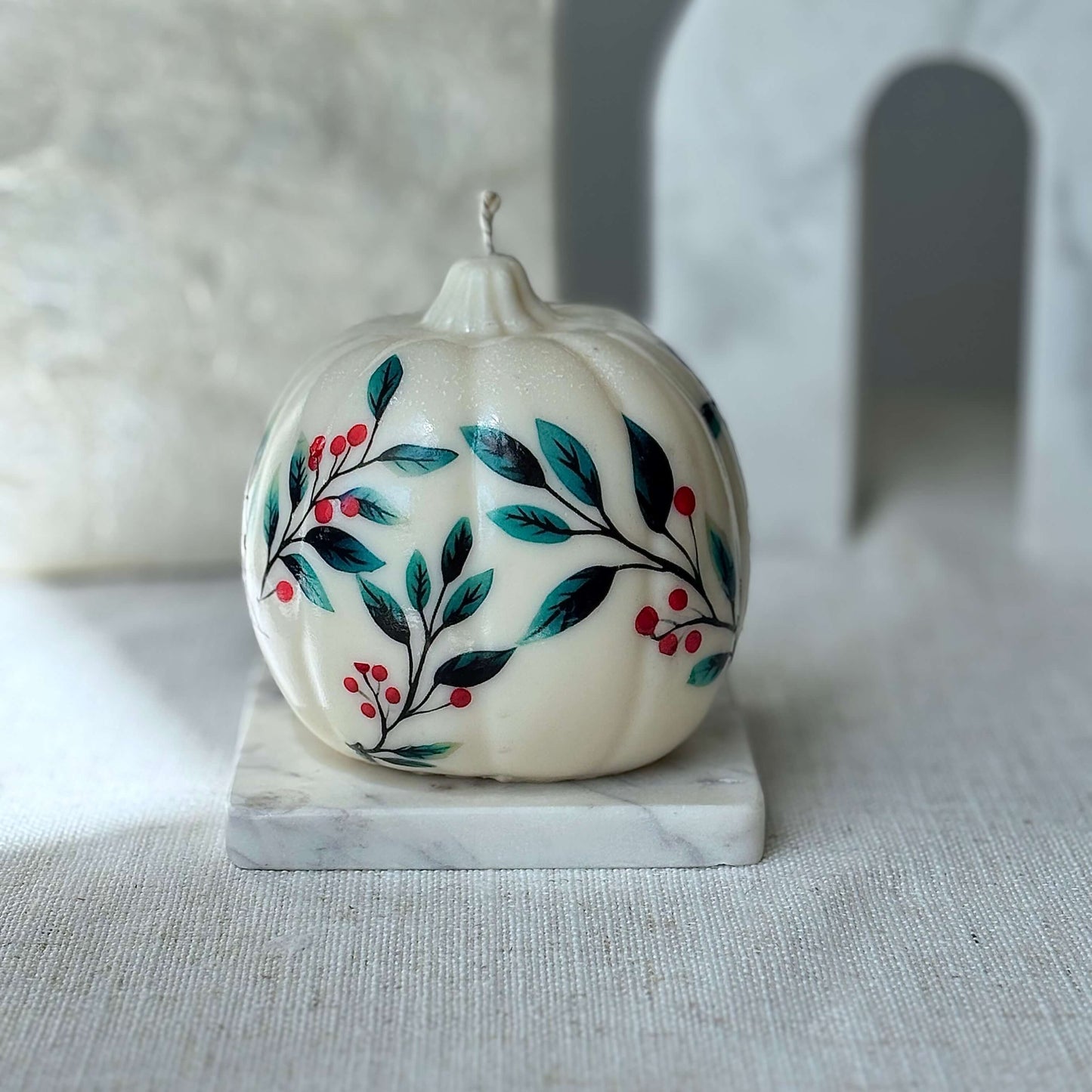 Creamy pumpkin candle with floral and berry accents on a marble base, perfect for Thanksgiving, Christmas, Halloween, birthday, or autumn home styling