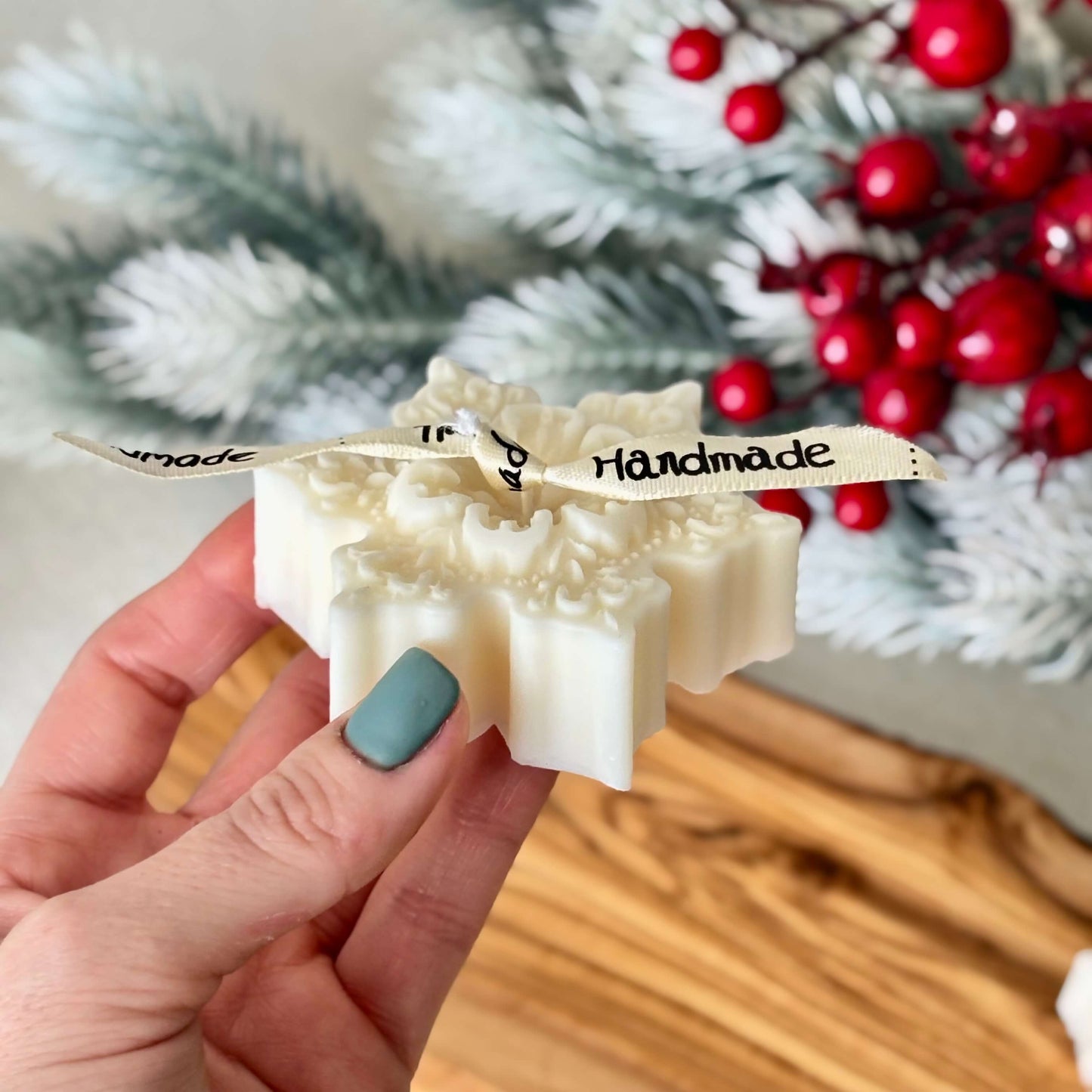 Elegant decorative snowflake candles on wood surface for Christmas gift