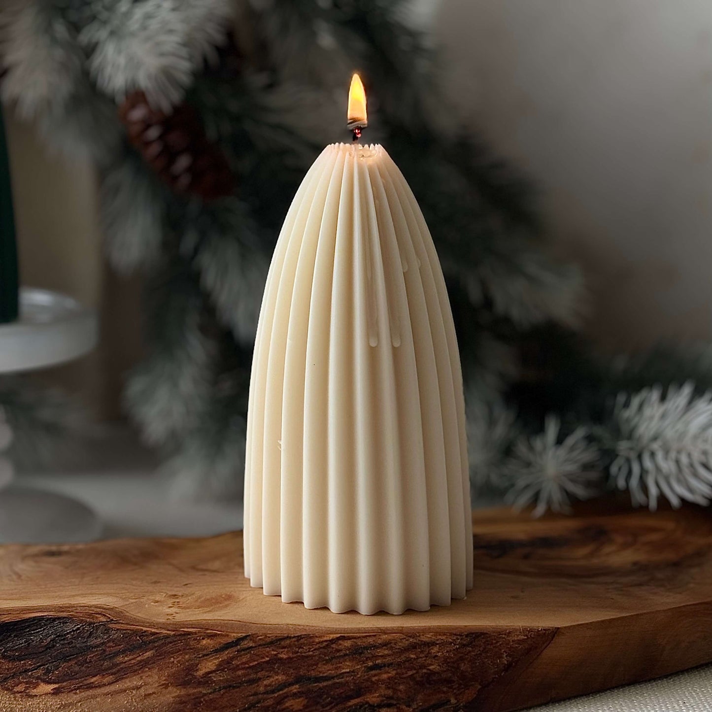 Ivory ribbed sculptural candle on wooden board, soy wax Christmas tree for holiday table décor