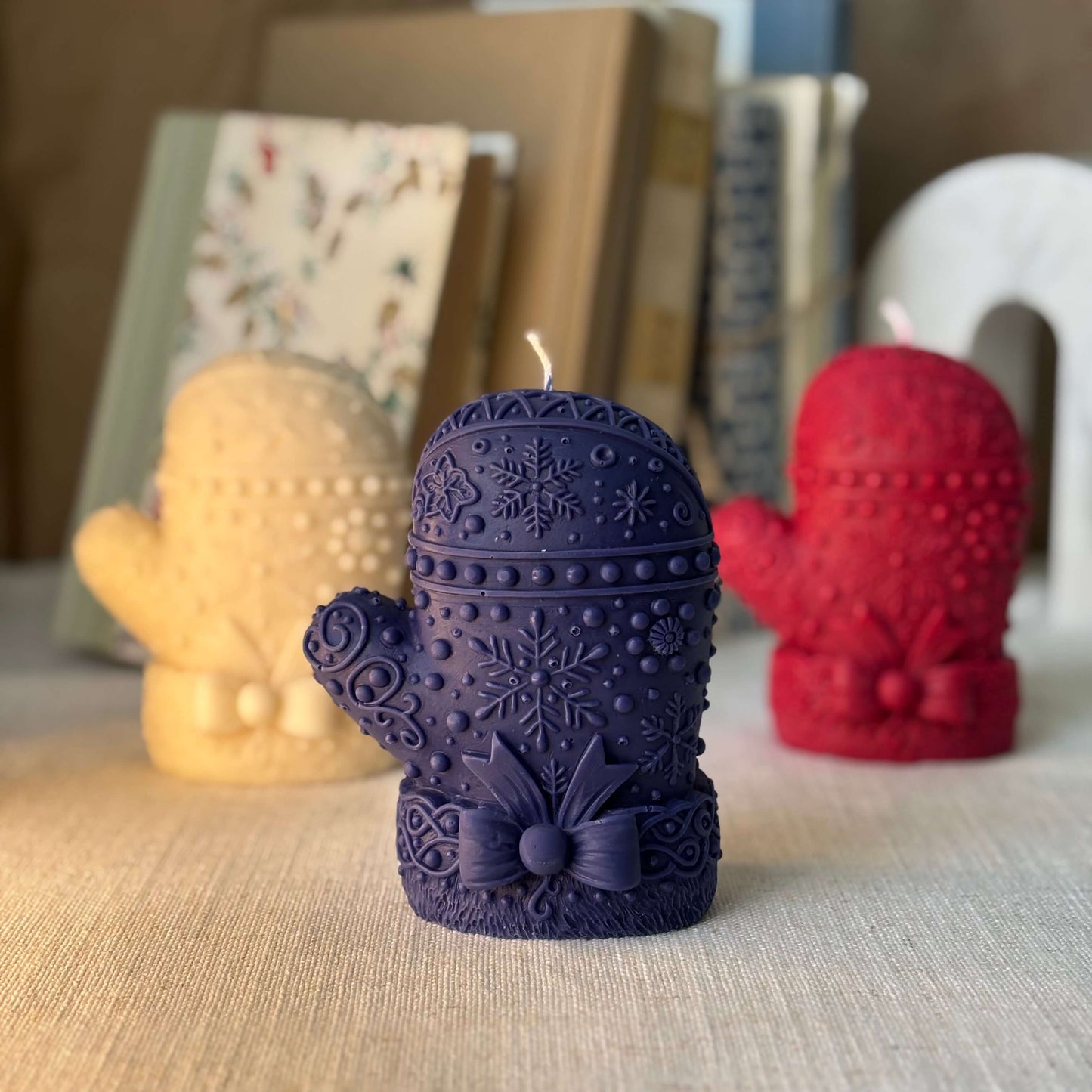 Elegant deep blue mitten candle with snowflake relief — handmade soy wax, premium oils, perfect Christmas and Secret Santa gift idea.