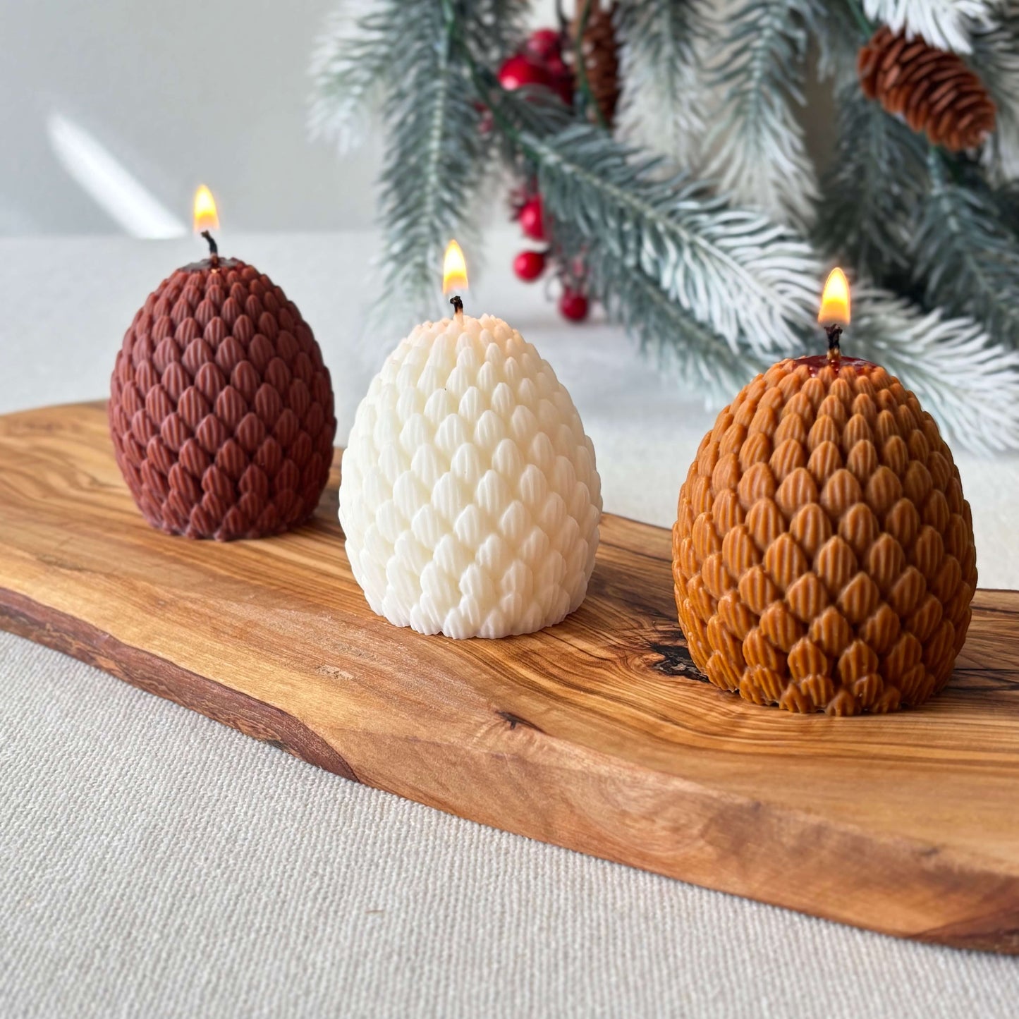 Handmade brown pinecone candle made of soy wax, festive holiday décor and Christmas gift idea