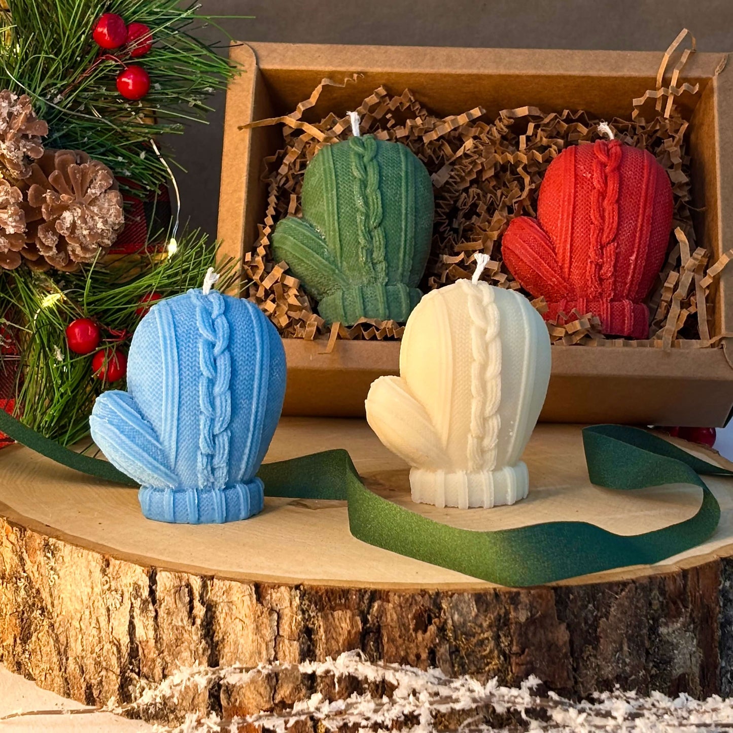 Cozy mitten candles in white and blue with gift box for Christmas or winter hostess present