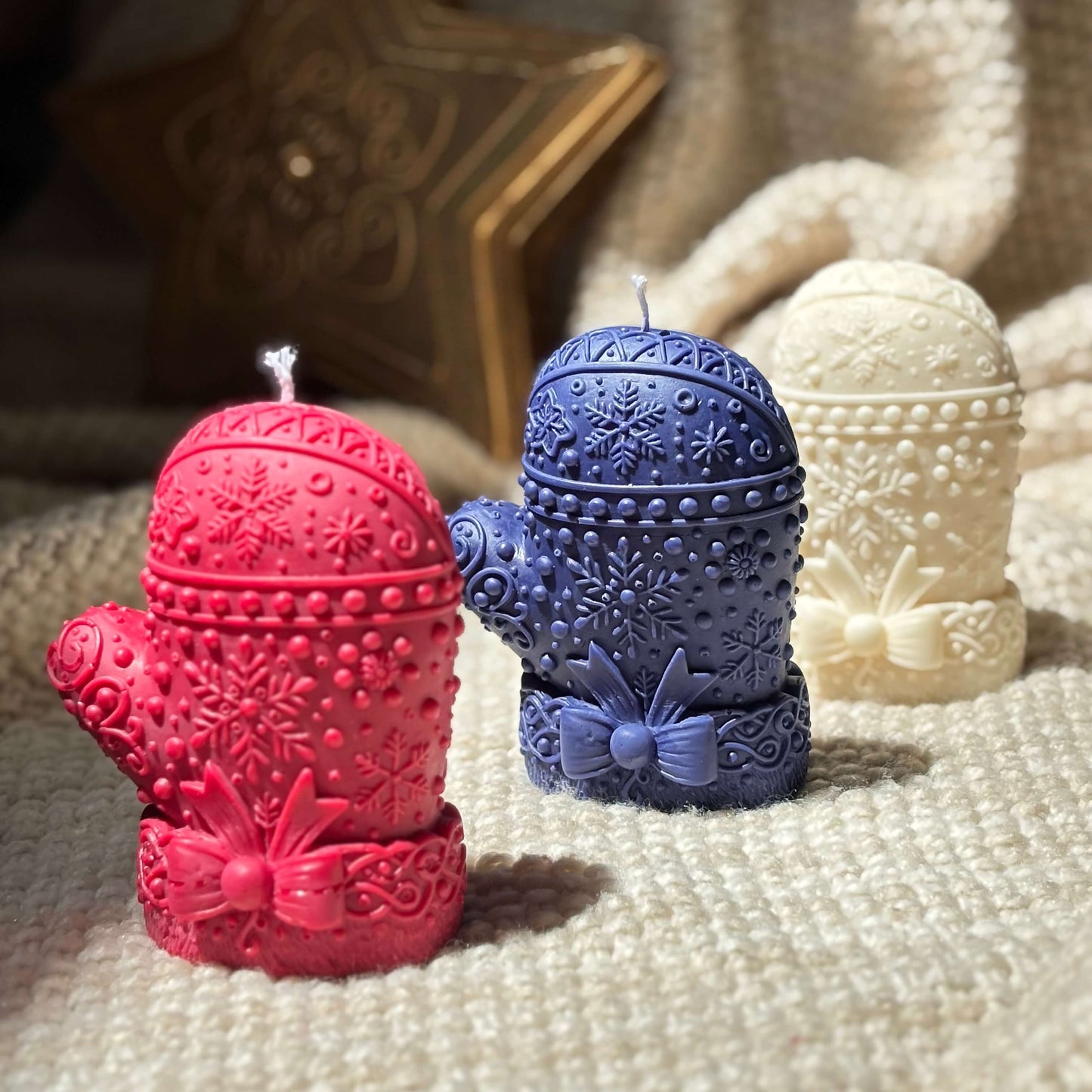 Handcrafted mitten candles in festive red, deep blue, and ivory white — soy wax with premium fragrance oils, Christmas decor and Secret Santa gift.