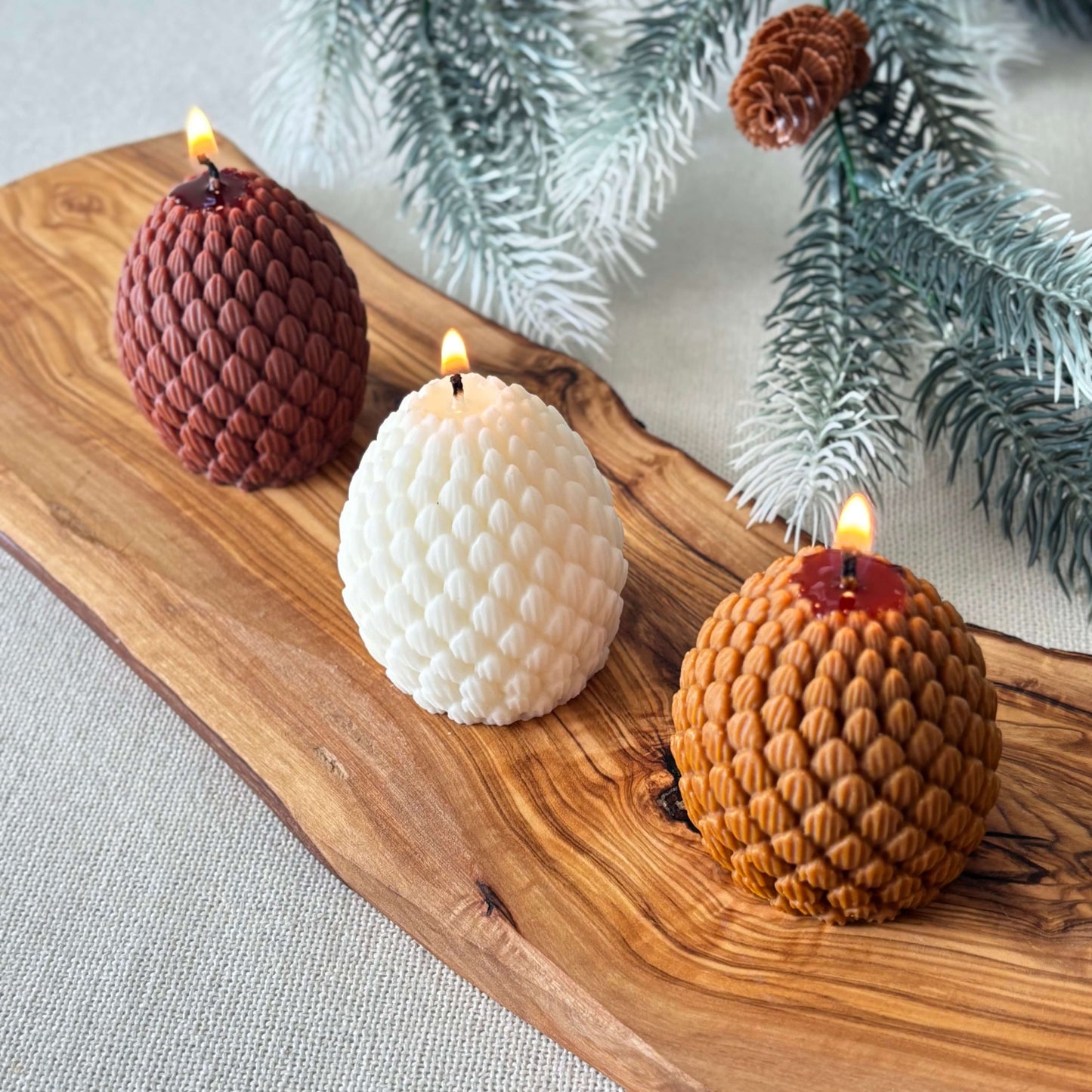 Christmas pinecone shaped candle crafted from soy wax, perfect for festive home decoration