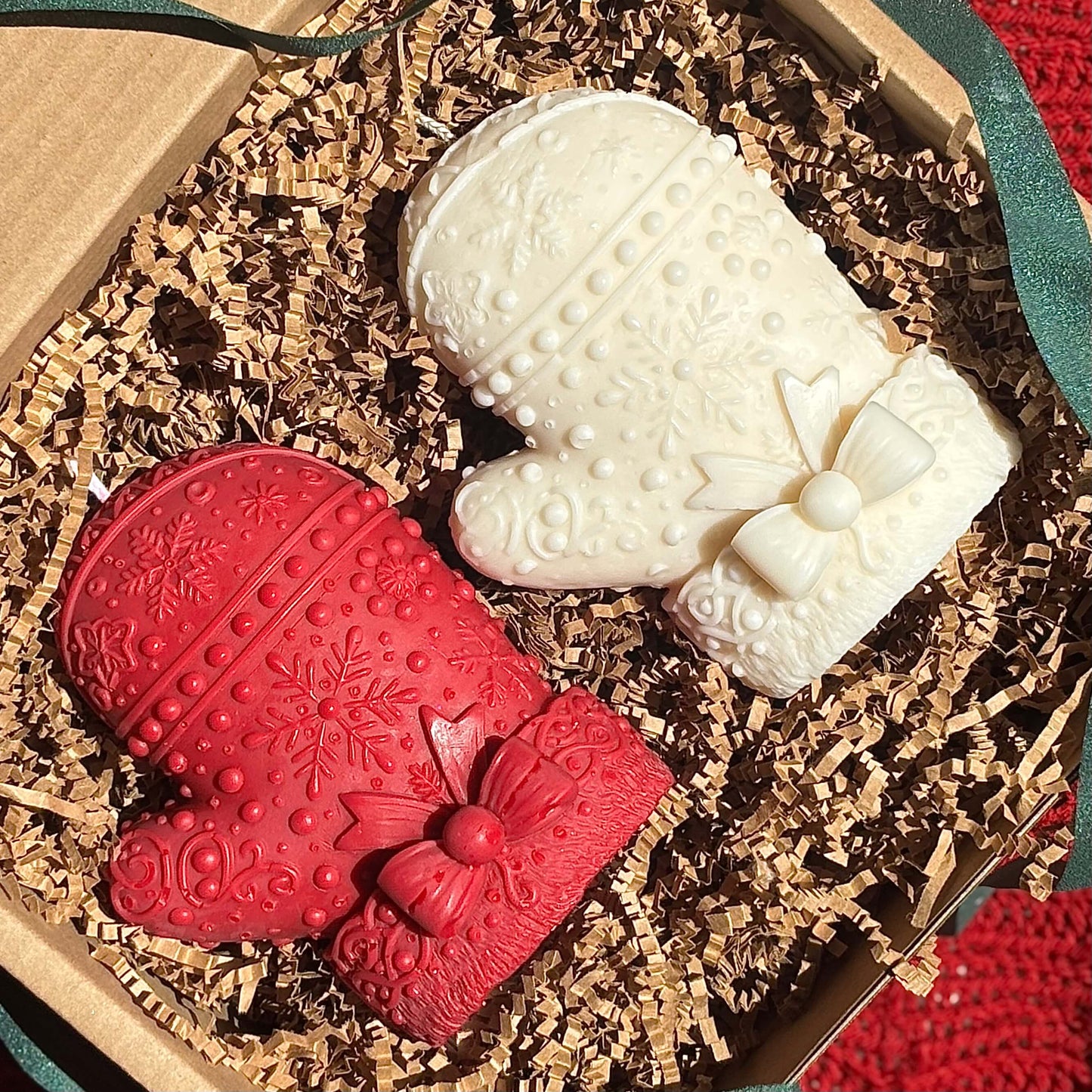 Red and ivory mitten candles with bow details in a gift box — handmade soy wax, premium fragrance oils, holiday gift for friends or coworkers.