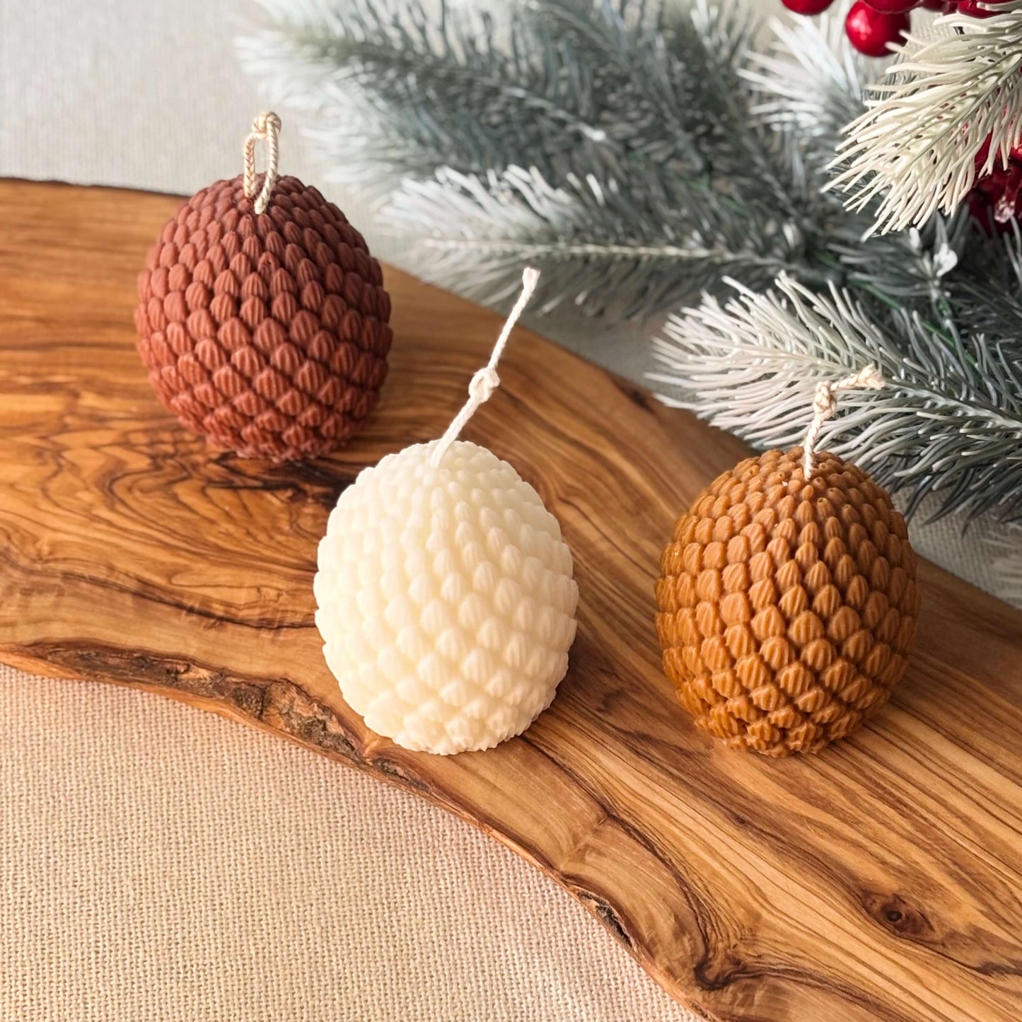 Eco-friendly soy wax winter candle in pinecone style, artisan handmade festive accent