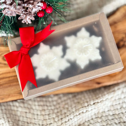 Natural soy wax snowflake candles ready for gifting with sustainable packaging