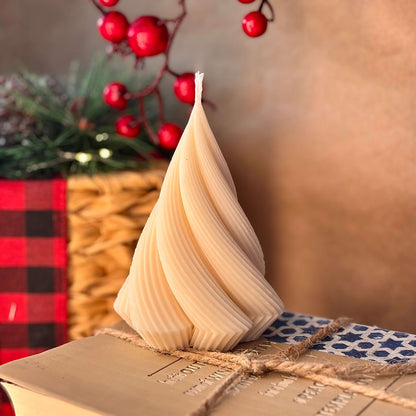 Beige spiral soy wax candle on twine-wrapped book, elegant table decoration or thoughtful gift for mom

