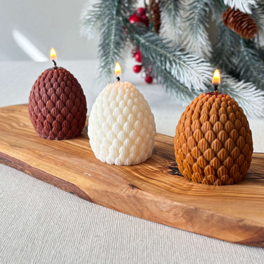 Handmade brown pinecone candle made of soy wax, festive holiday décor and Christmas gift idea