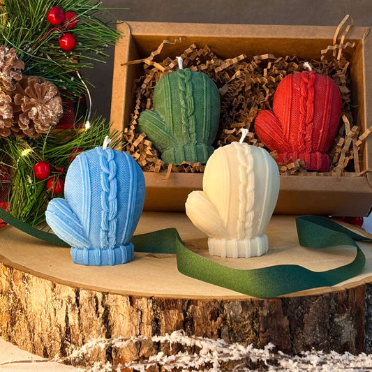 Cozy mitten candles in white and blue with gift box for Christmas or winter hostess present