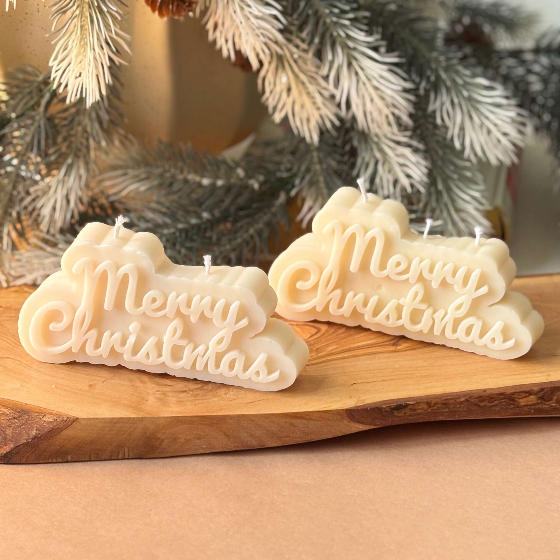 set of two handmade soy wax candles with christmas text ideal for corporate holiday gifts and winter decor