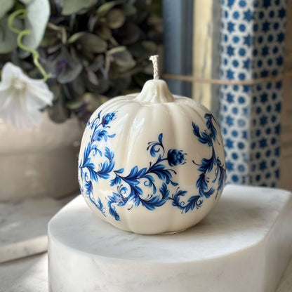 Cozy blue-and-white decorative candle with ceramic look, styled on a marble base with soft background — ideal for luxury gift or coworker surprise.


