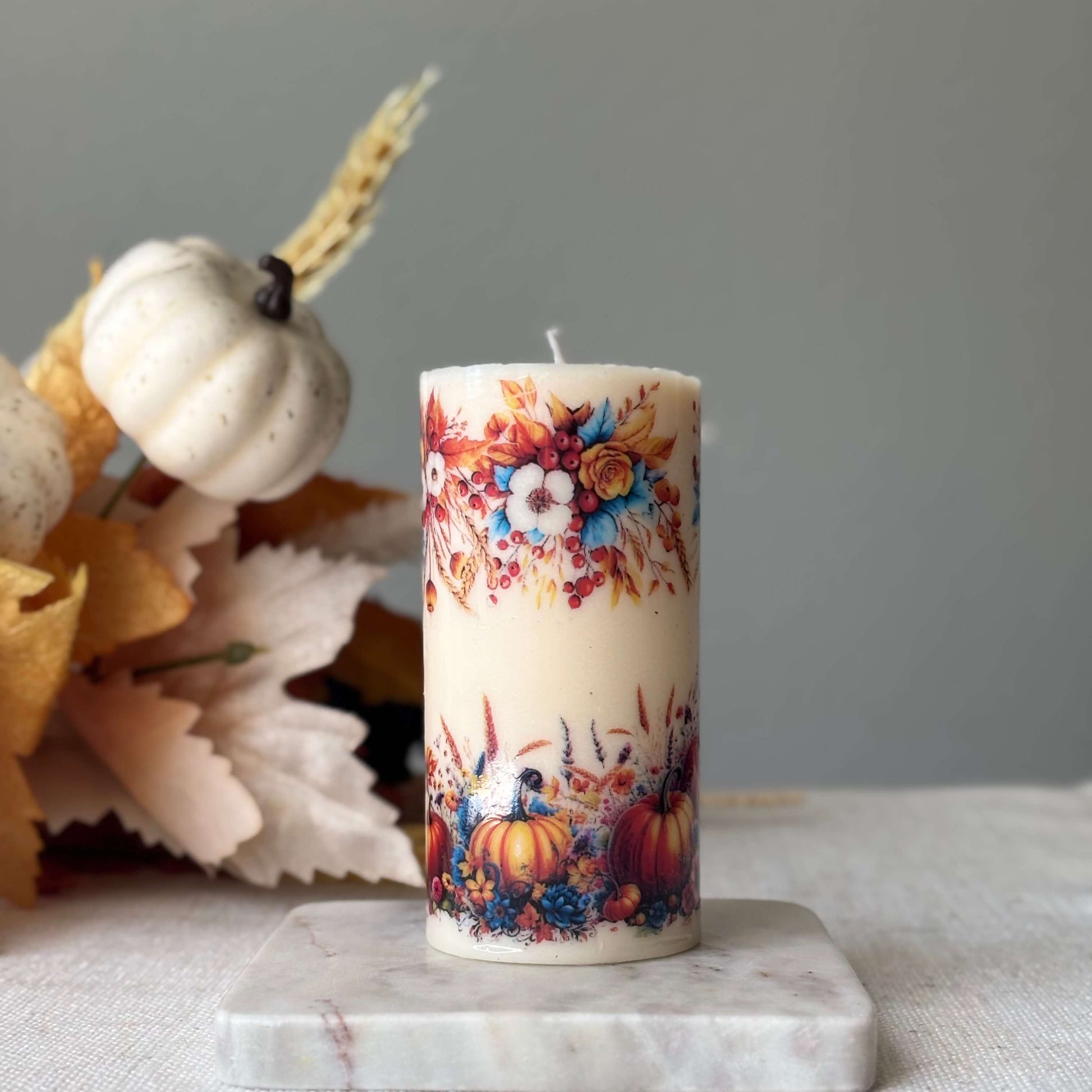 Cozy pumpkin holiday candle with autumn floral and harvest design, handmade seasonal candle for Thanksgiving, Halloween, and fall home décor.
