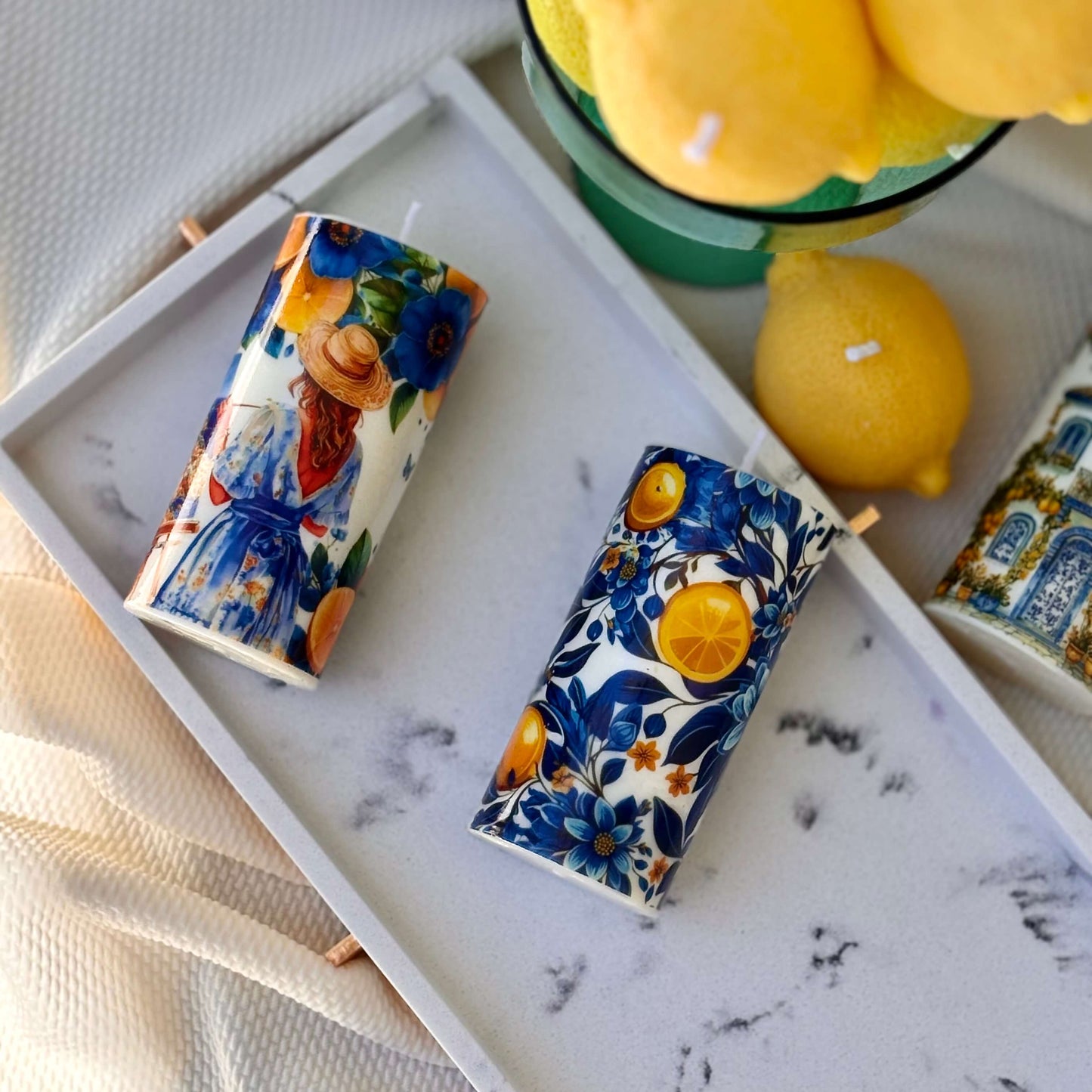 Lemon-themed eco-friendly candles in Italian ceramic style with fruit prints and summer decor mood


