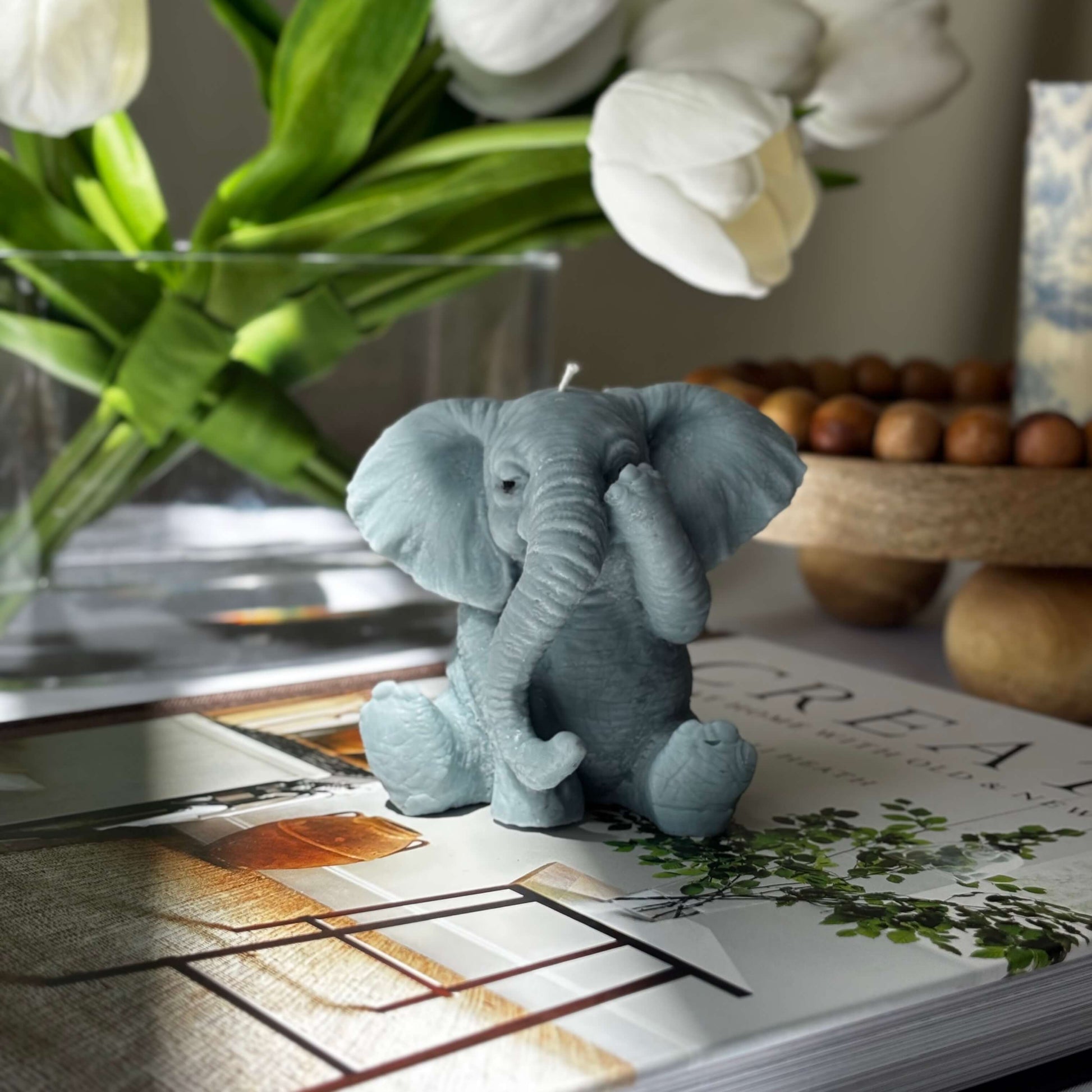 Handmade soy wax elephant candle with covered ears, cute sculptural decor or thoughtful animal-shaped gift.
