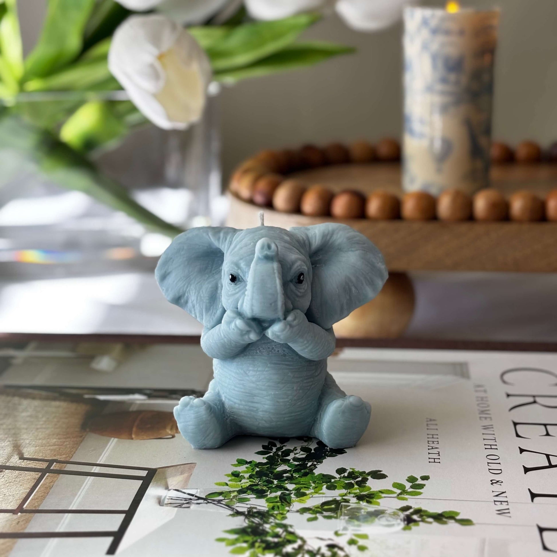 Handmade soy wax elephant candle with paws to mouth, sculptural gift decor for her or nursery table.
