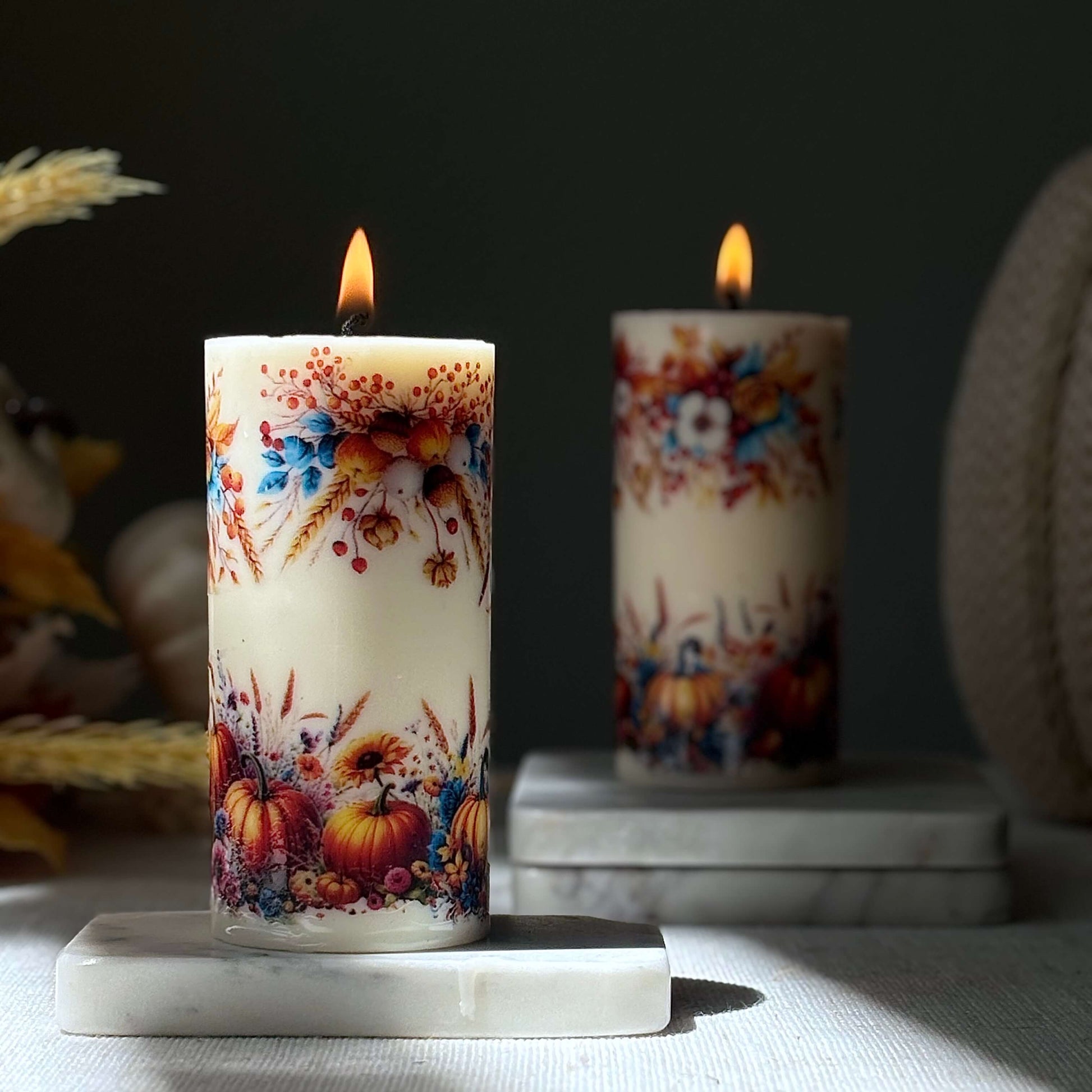 Fall pumpkin candle with autumn floral details, cozy holiday decor accent, handmade candle for Thanksgiving and Halloween home decoration.