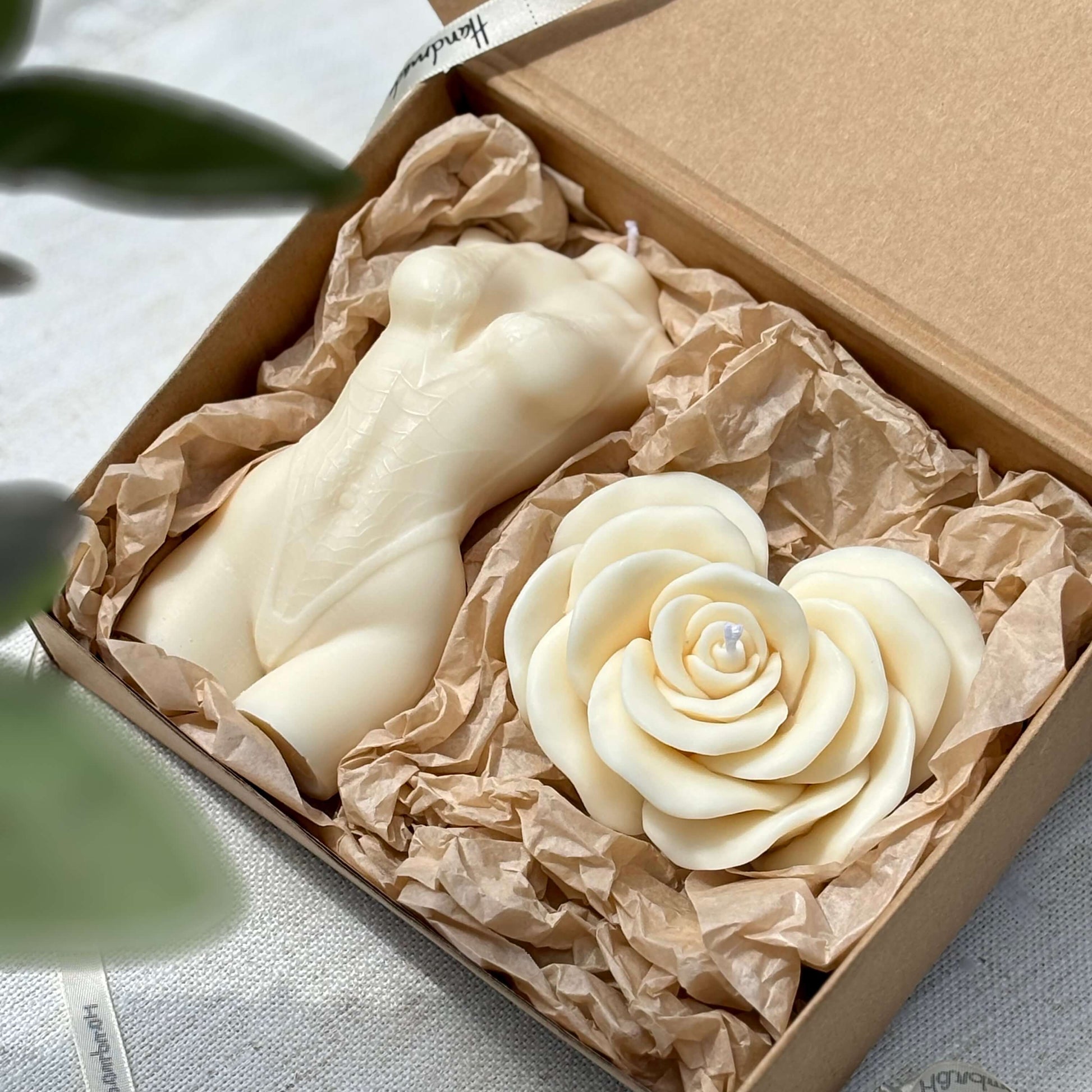 Decorative soy wax candle set featuring white female body candle and rose candle in kraft box