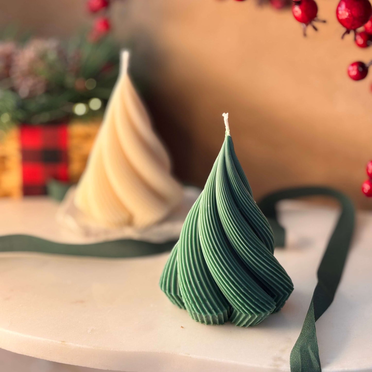 Green ribbed soy wax candle in tree shape with cozy festive backdrop, ideal for Secret Santa or Thanksgiving dinner decor

