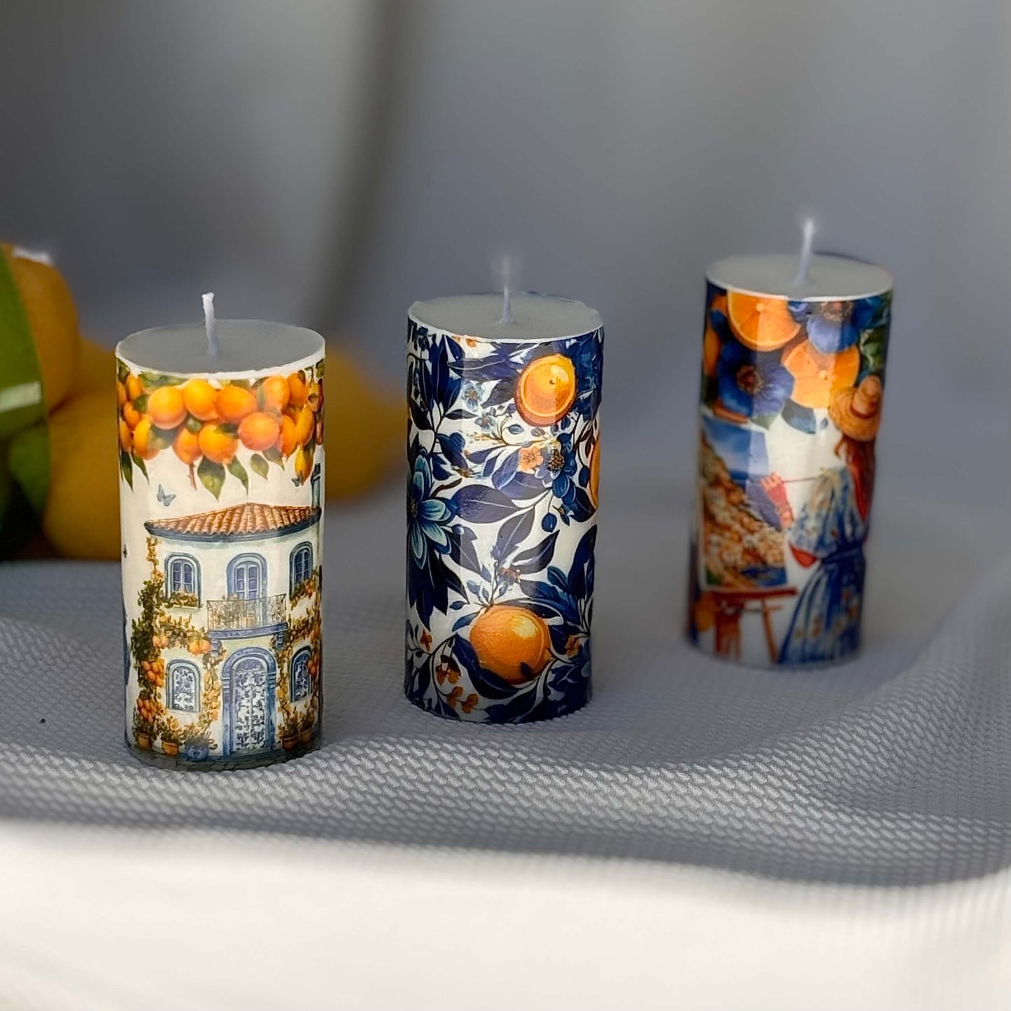 Decorative Italian-style candles with lemon house, floral prints and Mediterranean ceramic art