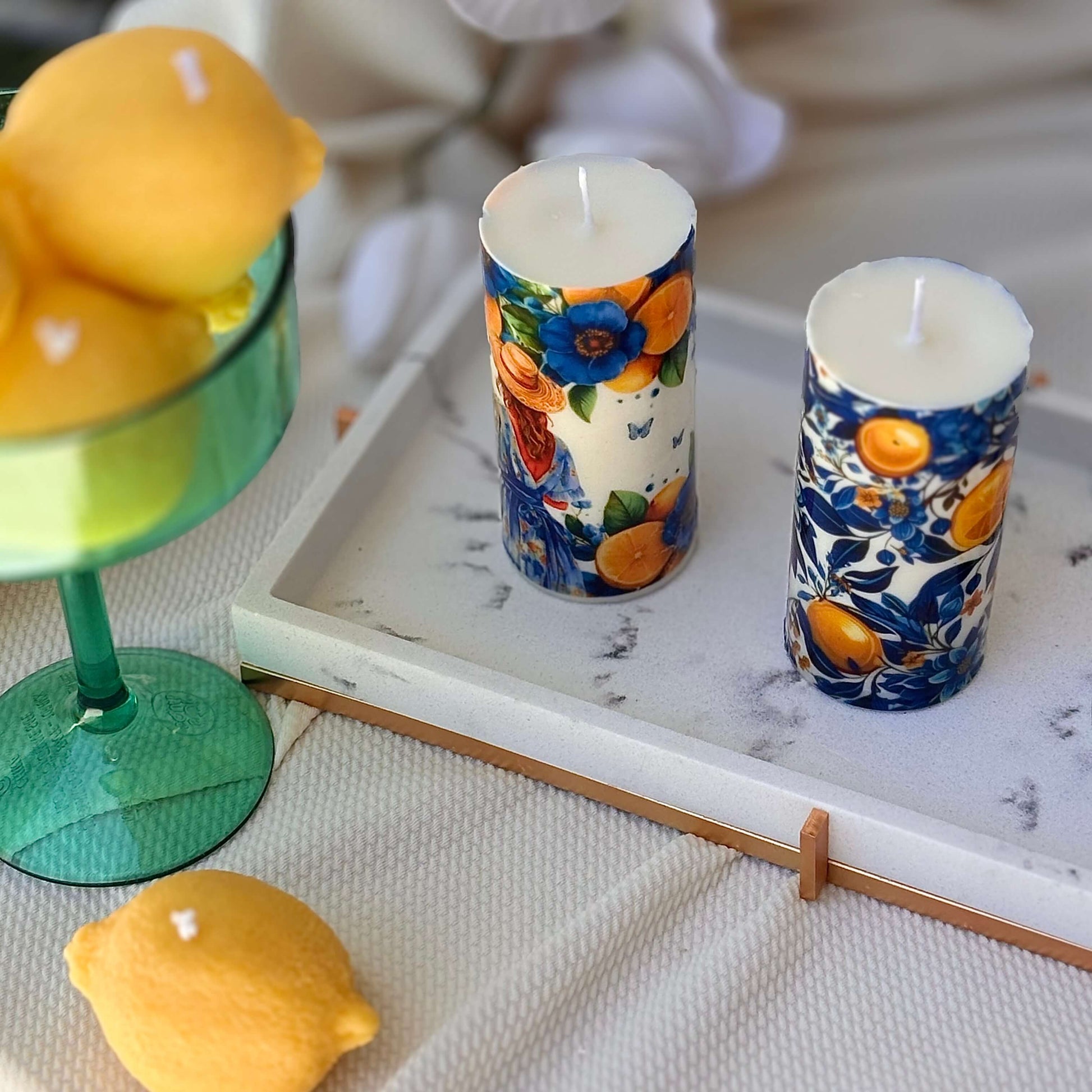 Lemon-themed decorative candles in Italian ceramic style with citrus and floral prints

