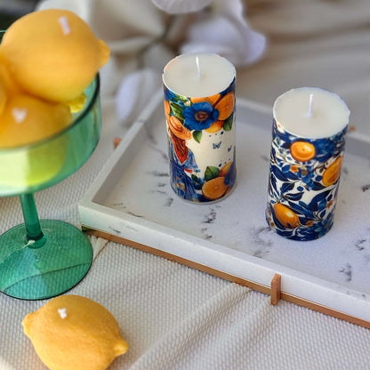 Lemon-themed decorative candles in Italian ceramic style with citrus and floral prints

