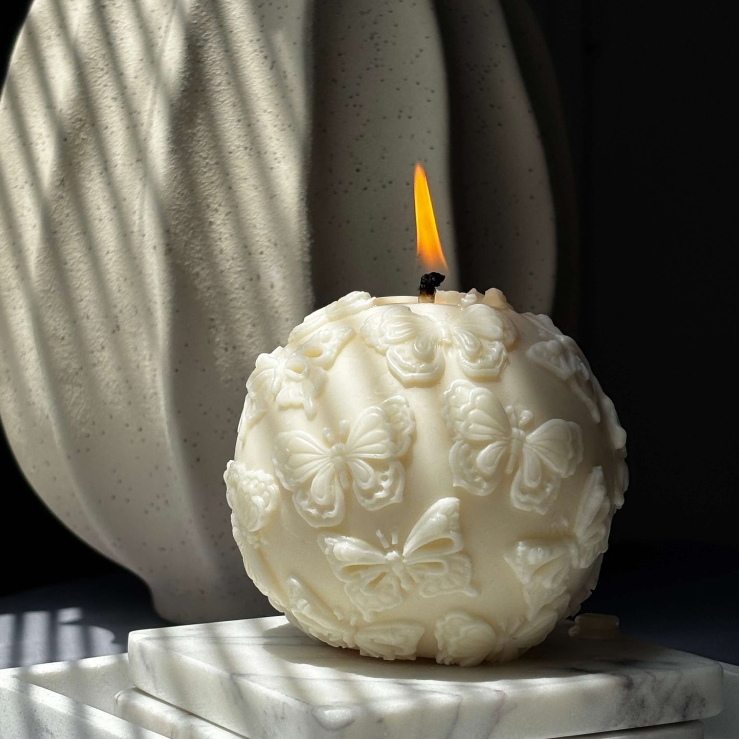 Luxury soy candle with butterflies ready for gifting
