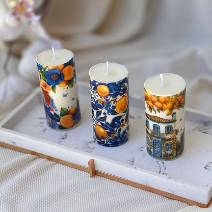 Handmade Mediterranean candles with citrus art and toile de jouy blue flowers on marble tray


