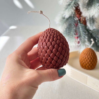 Winter pinecone candle decoration, artisanal soy wax candle for festive home and gift giving